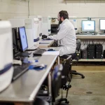 Staff working with samples inside a state public health laboratory