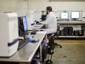 Staff working with samples inside a state public health laboratory