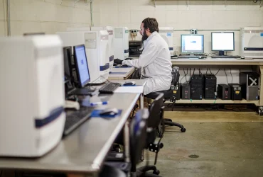 Staff working with samples inside a state public health laboratory