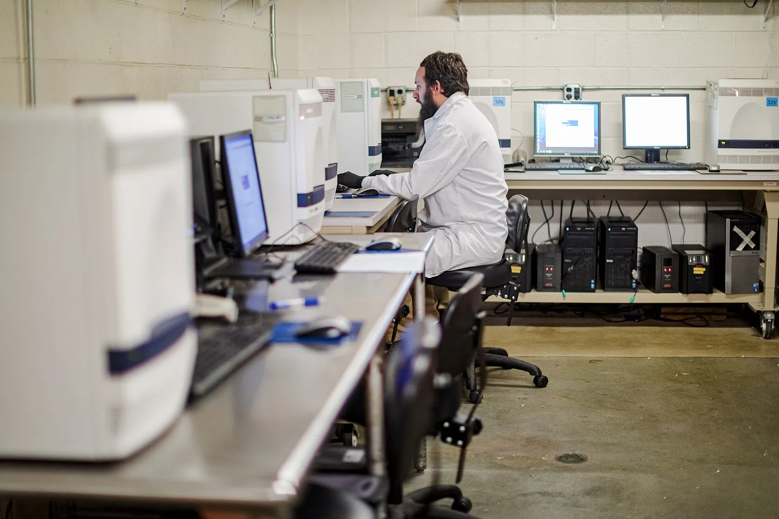 Staff working with samples inside a state public health laboratory