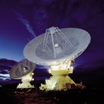 Large radio telescope dishes against the sky