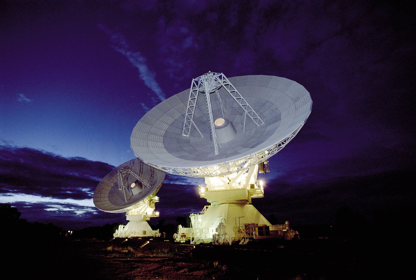 Large radio telescope dishes against the sky