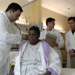 Doctor examines patient