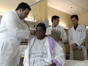 Doctor examines patient
