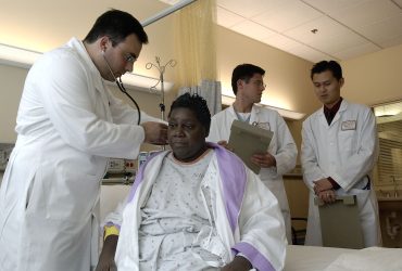 Doctor examines patient